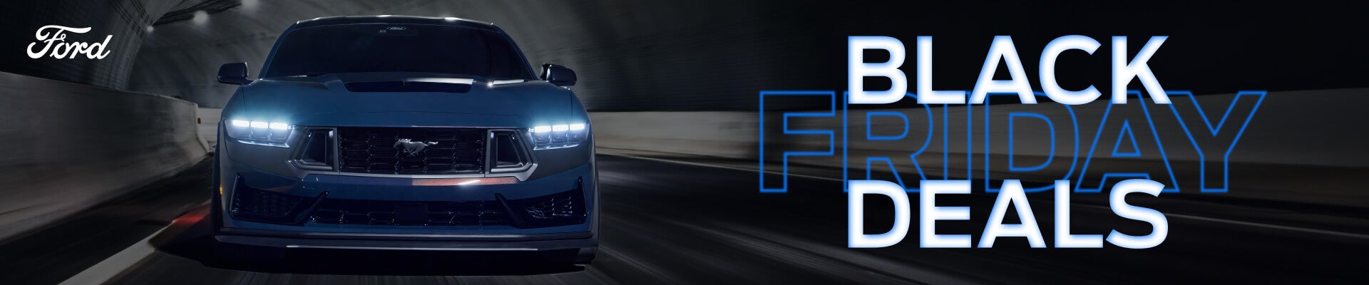 Front view of a dark blue Ford Mustang Dark Horse driving in a tunnel with Black Friday Deals text.